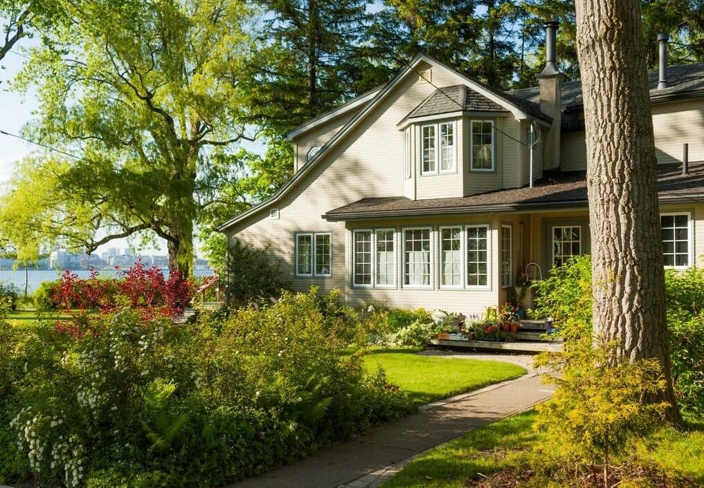 Classic white building with ornate balconies and greenery